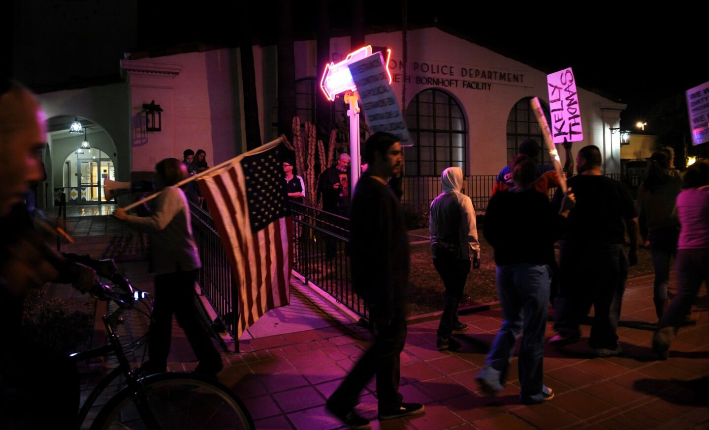 Protesters march outside the Fullerton police station after two former officers were acquitted in the killing of Kelly Thomas.