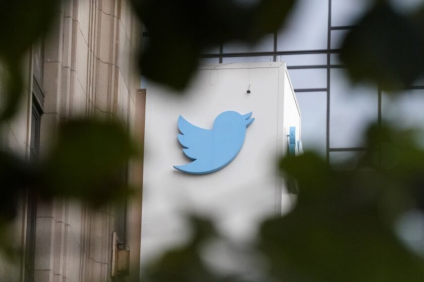 FILE - A sign at Twitter headquarters is shown in San Francisco, Dec. 8, 2022. New research shows climate misinformation has been flourishing on Twitter since Elon Musk purchased the platform last year. (AP Photo/Jeff Chiu, File)
