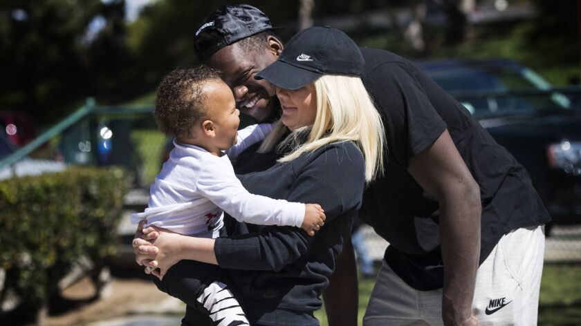 Lakers power forward Julius Randle spends family time with wife Kendra and 1-year-old son Kyden at a park near their home.