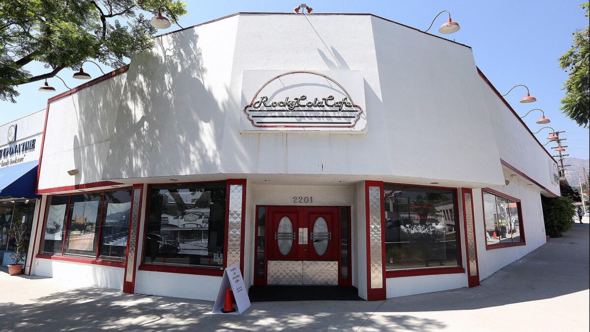 Rocky Cola Café, which closed at the end of December 2012, was still vacant in Montrose in this July 28, 2017, photo. The windows display historic photos of the city.