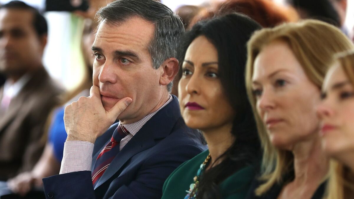 Mayor Eric Garcetti and Councilwoman Nury Martinez, center, listen to a panel of women discuss their experiences with sexual harassment in the workplace.