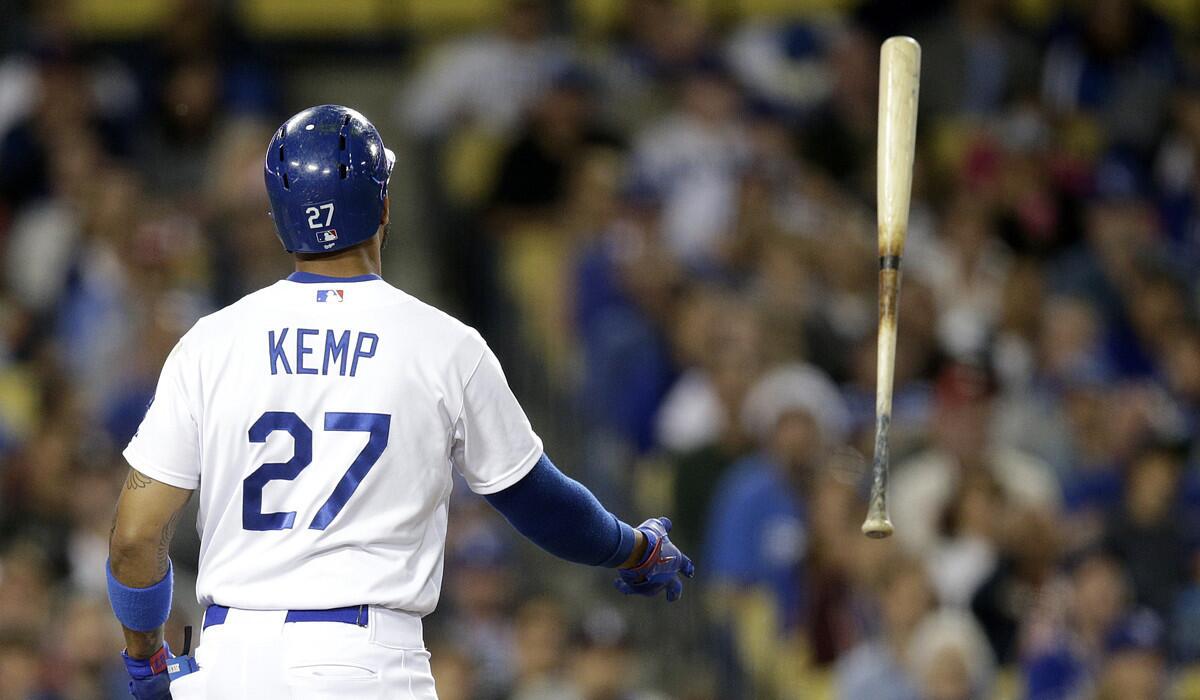 Dodgers center fielder Matt Kemp tosses his bat after striking out against the Phillies on Thursday night.
