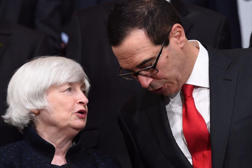 US Federal Reserve Chair Janet Yellen (L) speaks with US Treasury Secretary Steve Mnuchin before the G20 Finance ministers group photo at the IMF headquarters in Washington, DC on October 12, 2017. / AFP PHOTO / ANDREW CABALLERO-REYNOLDSANDREW CABALLERO-REYNOLDS/AFP/Getty Images ** OUTS - ELSENT, FPG, CM - OUTS * NM, PH, VA if sourced by CT, LA or MoD **