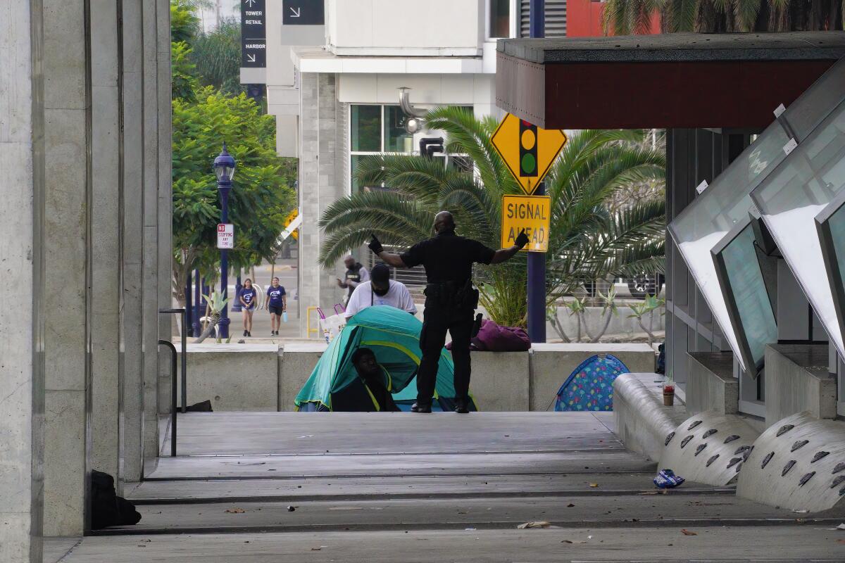 A tent set up on the sidewalk just outside the San Diego Central Library on Thursday, Aug. 18.
