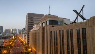 A building with an "X" sculpture on top.