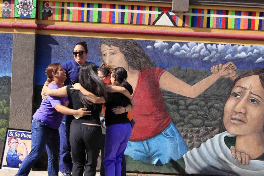Staff members of the Whole Woman's Health clinic in McAllen, Texas, celebrate in front of a mural on the side of their building after Monday's Supreme Court ruling against the state's abortion restrictions.