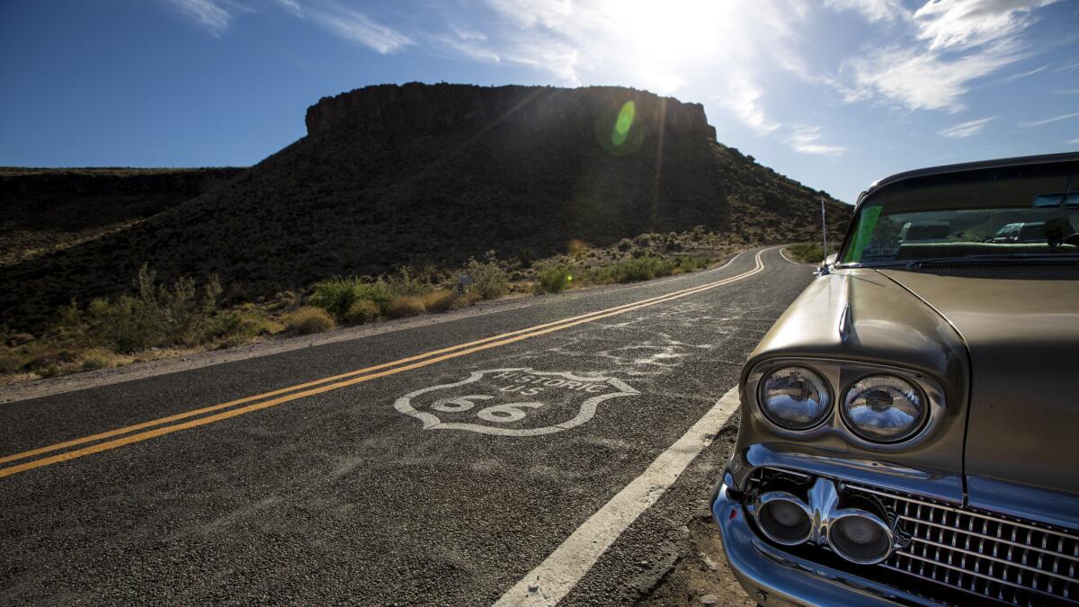 The Black Mountains provide a backdrop for a vintage Chevrolet in Cool Springs, Arizona. (Brian van der Brug / Los Angeles Times)