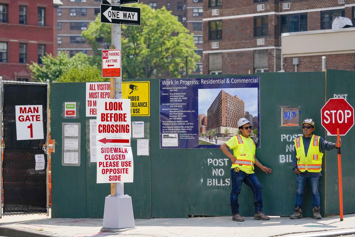 Construction workers directing traffic