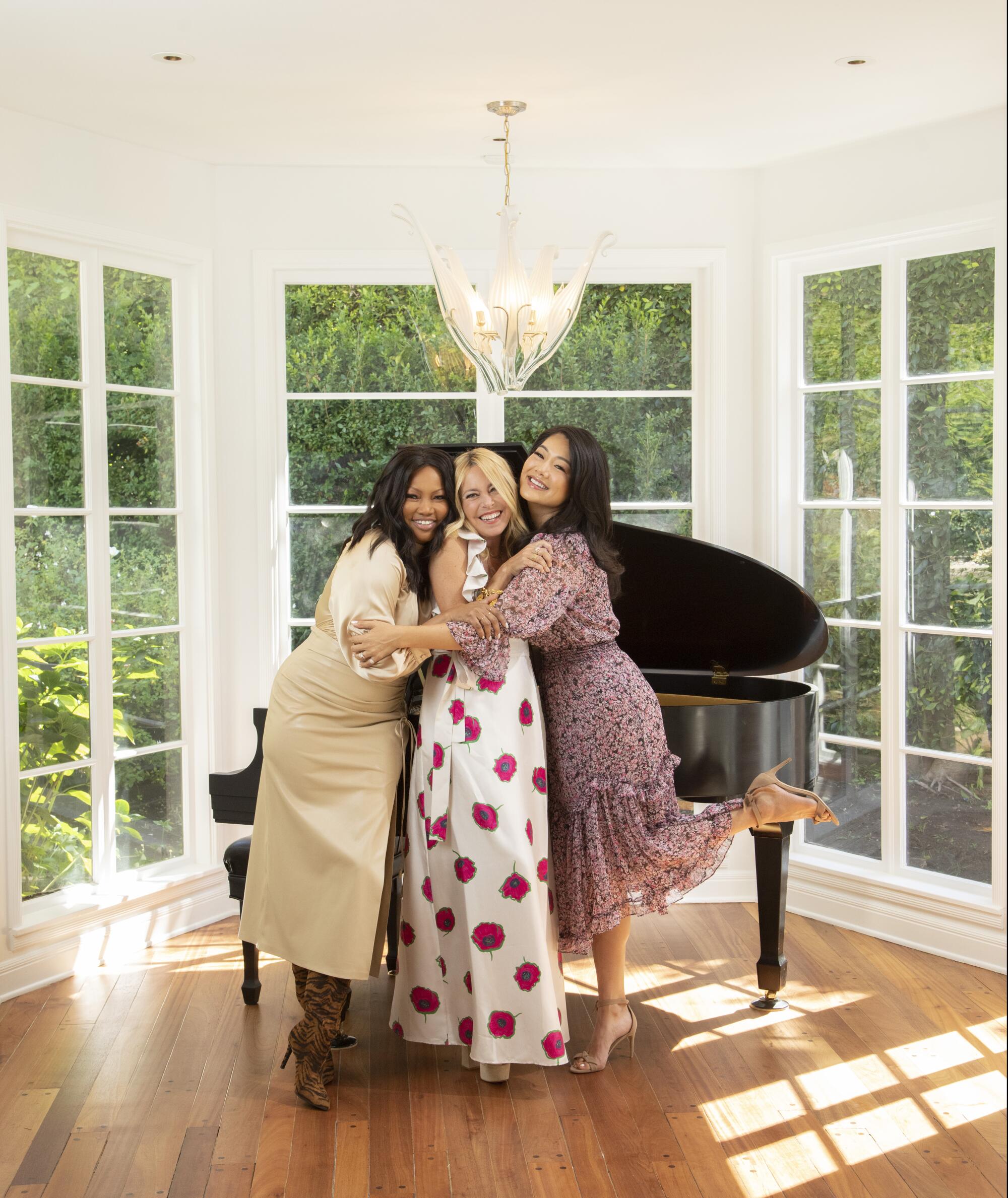 "Real Housewives of Beverly Hills" stars Garcelle Beauvais, Sutton Stracke and Crystal Kung Minkoff share a hug.