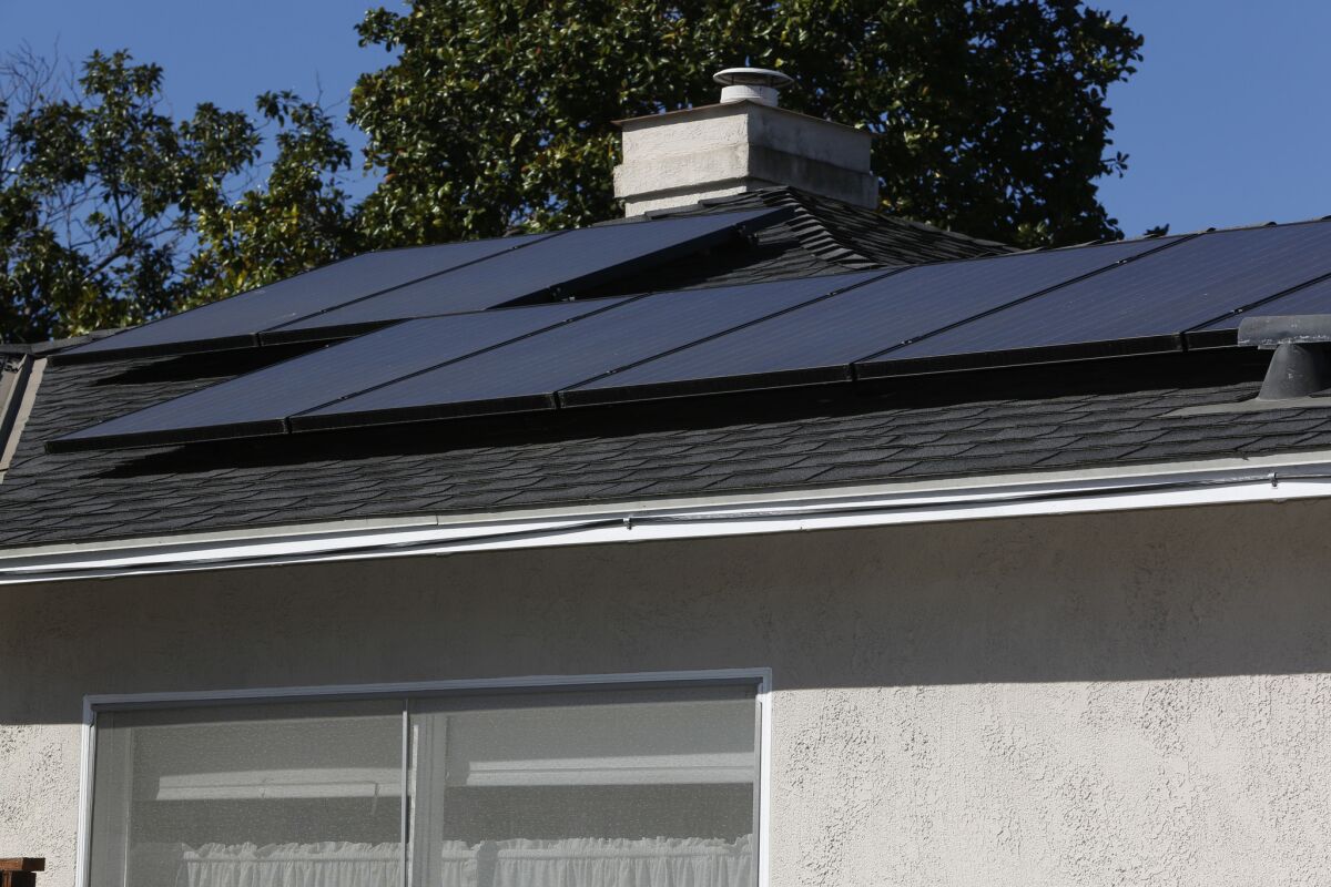 Nevada regulators voted to drastically reduce the value of credits that rooftop solar customers earn for generating excess energy. A recent California plan largely keeps the state's current benefits intact. Above, a home in Culver City.