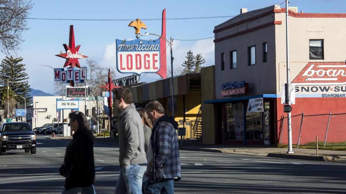 People cross the street in the Shasta County town of Redding.