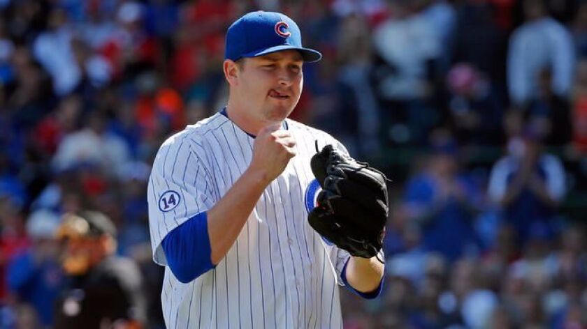 Trevor Cahill of the Chicago Cubs celebrates after striking out Jhonny Peralta of the St. Louis Cardinals (not pictured) to end the fifth inning at Wrigley Field on September 19, 2015 in Chicago, Illinois.