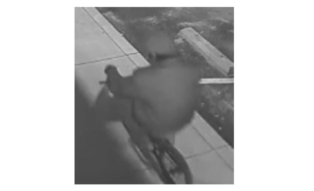 Surveillance video of man on a bicycle near AA Fashion clothing store