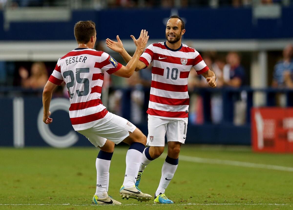 Landon Donovan, right, and his U.S. teammates finish the year ranked 14th in the world by FIFA.