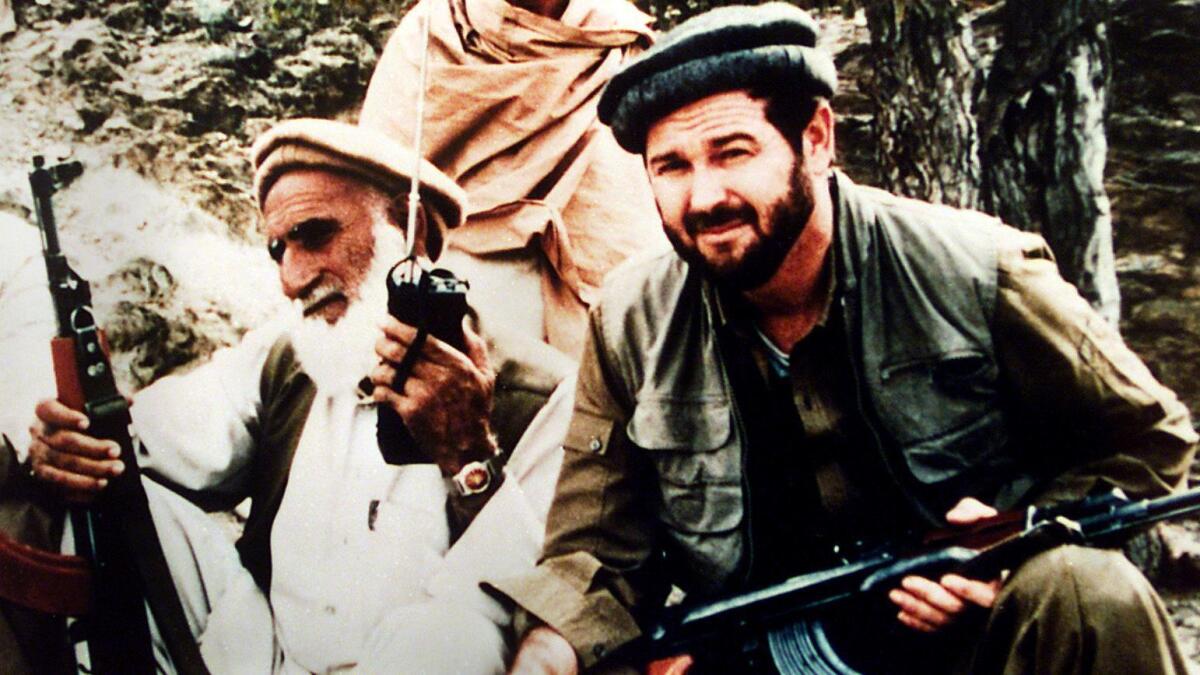 Rep. Dana Rohrabacher, right, is shown during his visit to Afghanistan shortly after he was first elected to Congress.