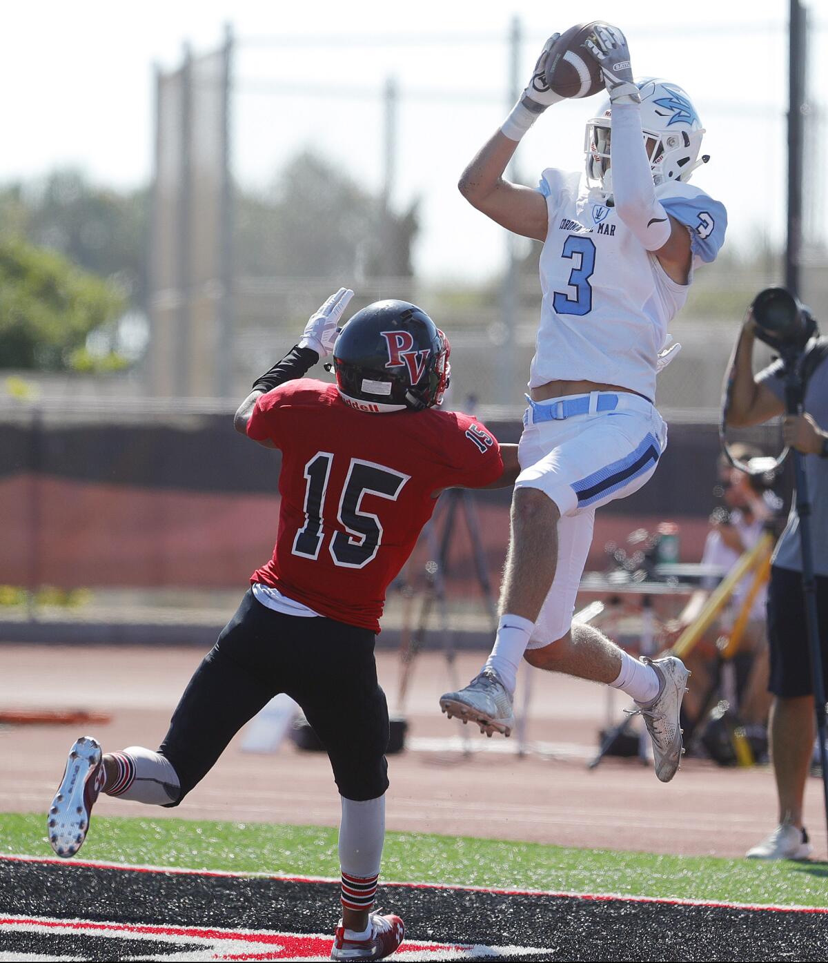 Tommy Griffin of Corona del Mar catches a 27-yard touchdown over Palos Verdes' David Lam in a nonleague road game on on Friday.