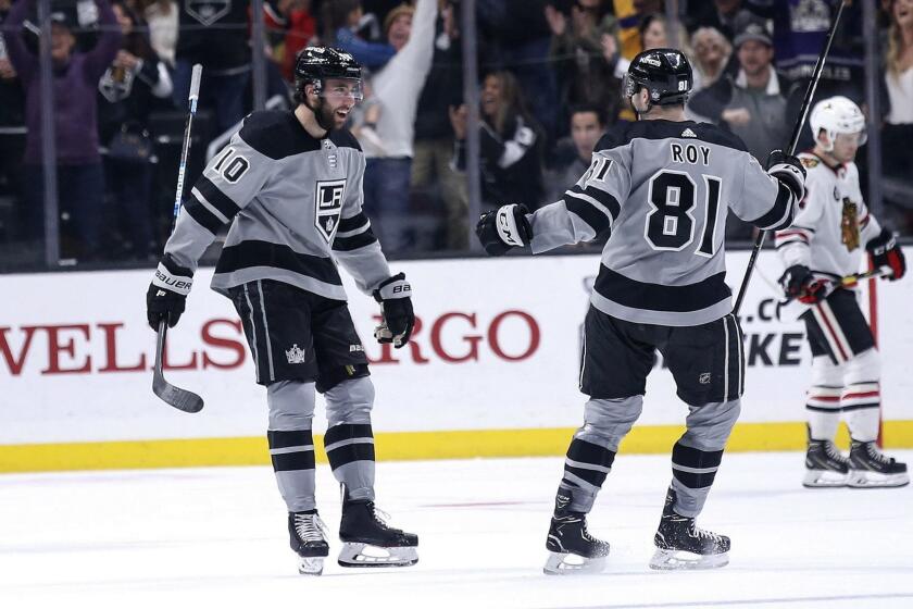 Los Angeles Kings forward Michael Amadio (10) celebrates his goal with Matt Roy (81) during the third period of the team's NHL hockey game against the Chicago Blackhawks on Saturday, March 30, 2019, in Los Angeles. (AP Photo/Ringo H.W. Chiu)