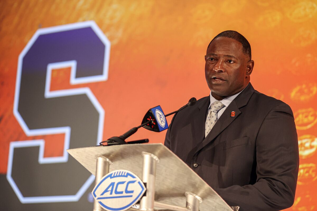 Syracuse head coach Dino Babers answers a question during an NCAA college football news conference at the Atlantic Coast Conference media days in Charlotte, N.C., Thursday, July 22, 2021. (AP Photo/Nell Redmond)