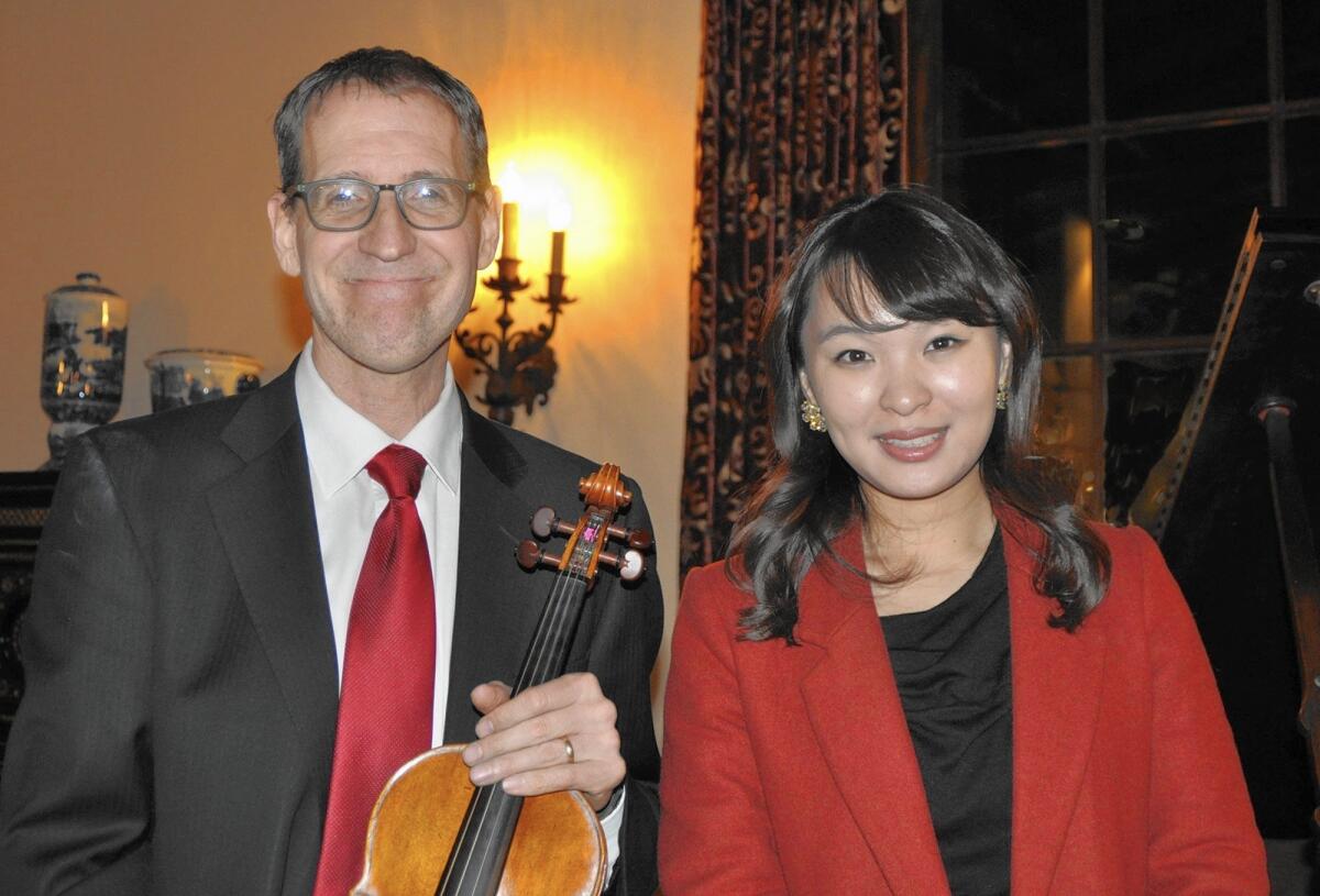 Lyndon Johnston Taylor, principal 2nd violin for the Los Angeles Philharmonic and pianist Jeong-Ah Ryu perform at the recent donor party for Hillsides. (Photo by Jane Napier Neely)