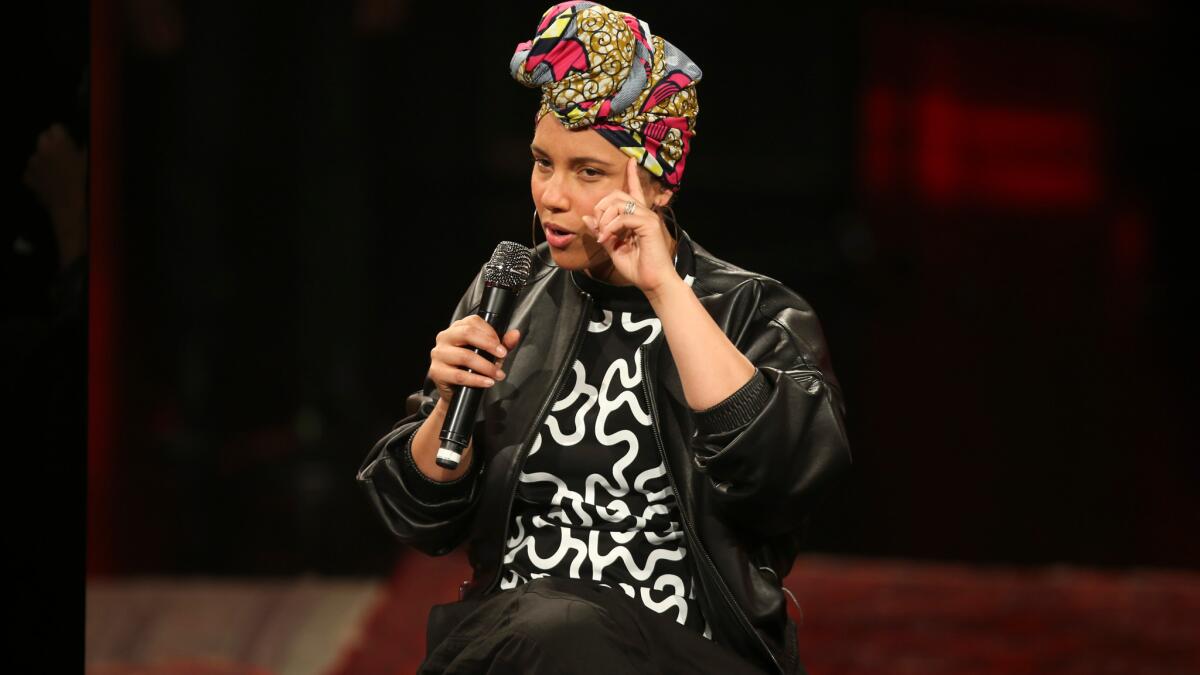 Alicia Keys, pictured in concert in Milan, Italy, wants fans to think about compulsive in-concert smartphone use.