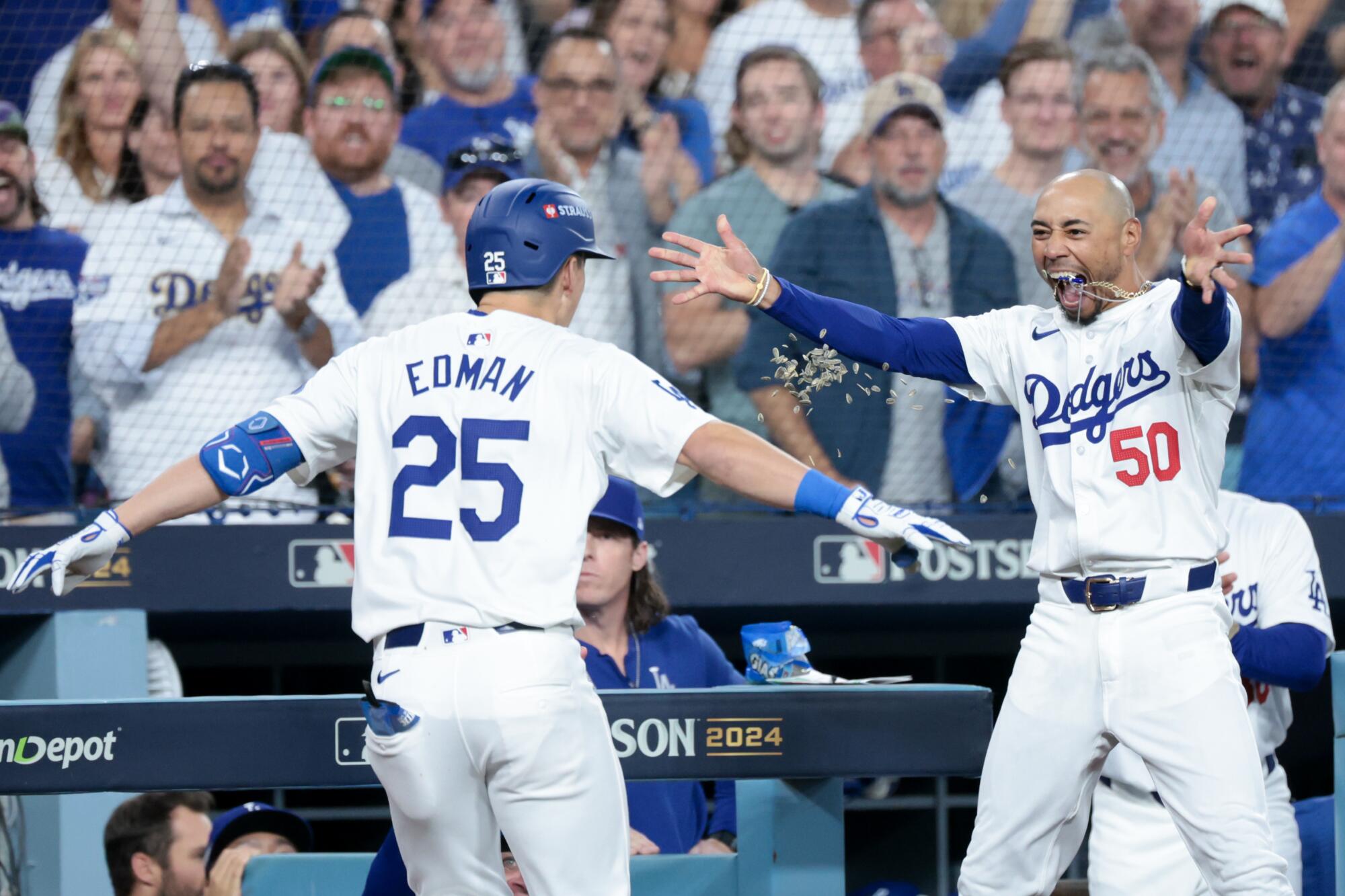 Mookie Bettsgreets Tommy Edman after Edman's two-run home run 