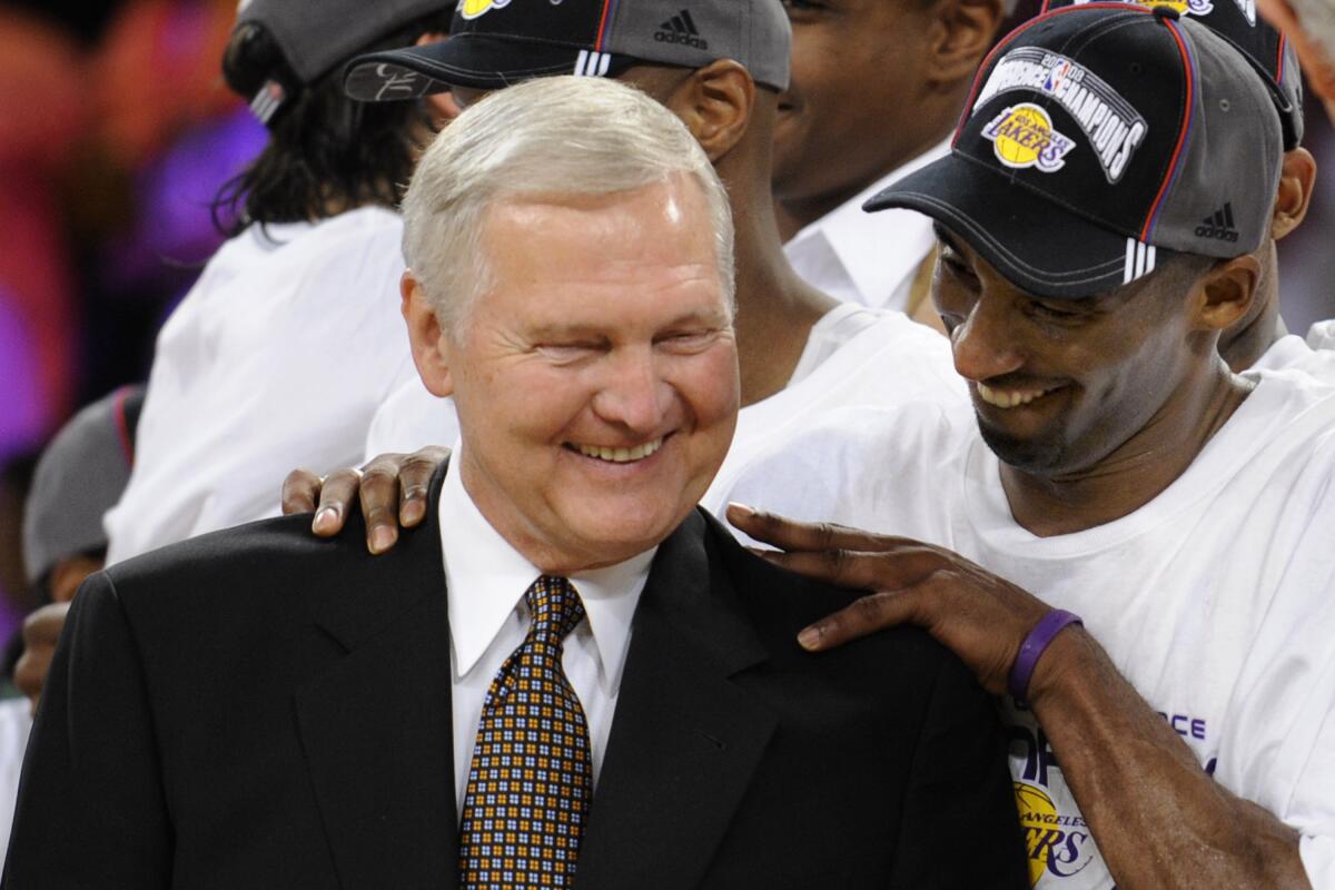 Lakers guard Kobe Bryant gives basketball great Jerry West a shoulder rub after a playoff win in 2008.
