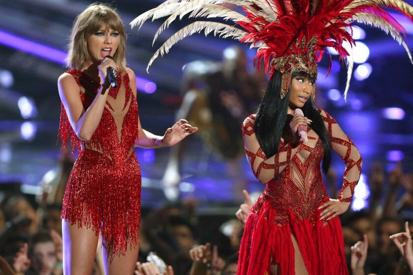 Taylor Swift, left, and Nicki Minaj perform at the MTV Video Music Awards.