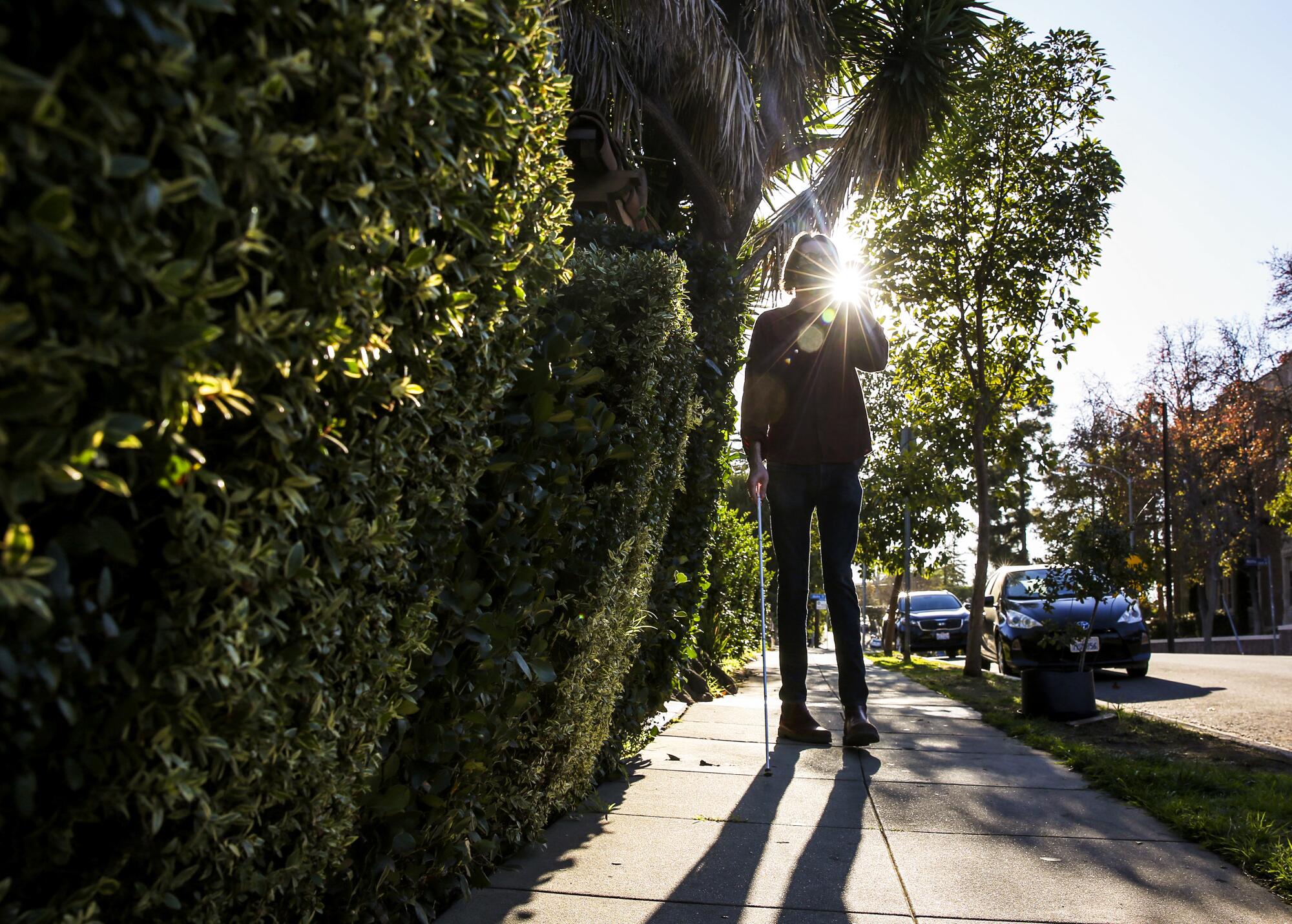 Will Butler, 31, walks to the grocery store from his home in Silver Lake.