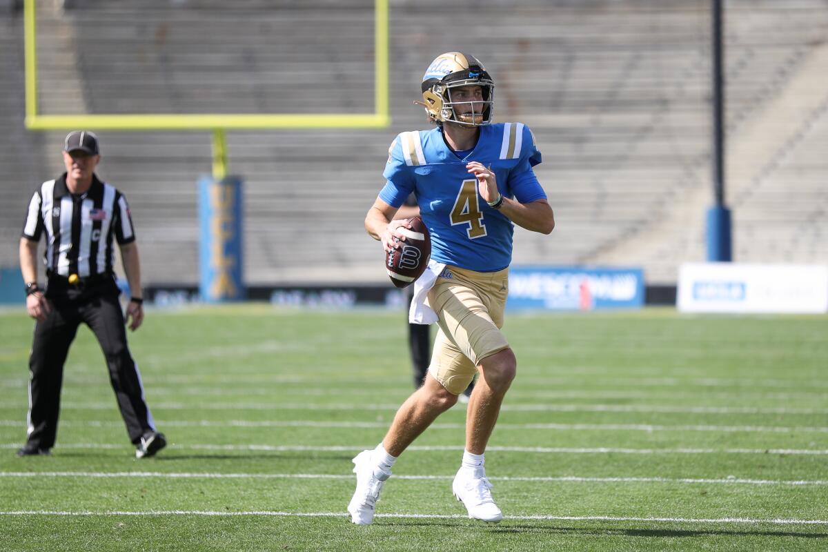 UCLA quarterback Ethan Garbers is shown running with the ball during the Bruins' spring showcase.