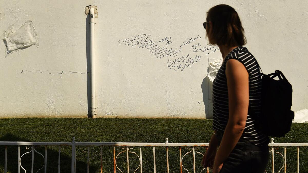 A woman walks past Hollywood Sikh Temple on Vermont Avenue in Los Feliz after it was vandalized. Artyom Manukyan was sentenced to 16 months for the crime.