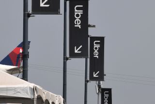 Uber signs are seen August 20, 2020 at Los Angeles International Airport in Los Angeles, California. - Rideshare service rivals Uber and Lyft were given a temporary reprieve on August 20 from having to reclassify drivers as employees in their home state of California by August 21. (Photo by Robyn Beck / AFP) (Photo by ROBYN BECK/AFP via Getty Images)