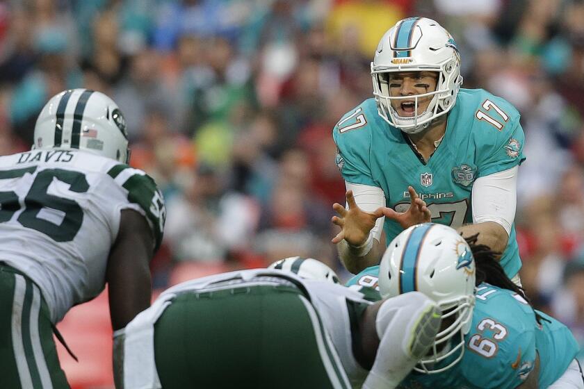 Miami Dolphins quarterback Ryan Tannehill calls out instructions for his teammates during a game against the New York Jets at London's Wembley Stadium on Oct. 4.