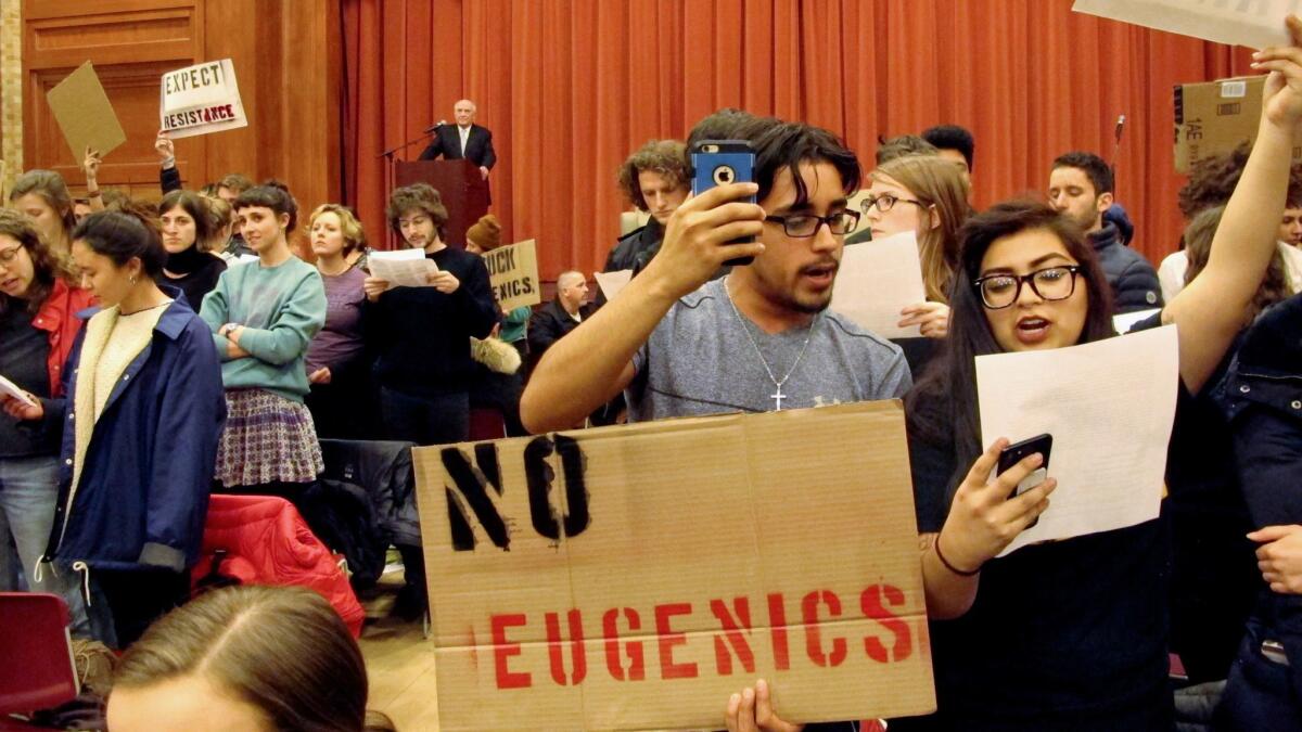 Middlebury College students turn their backs on Charles Murray (at lectern) on March 2. Shouts by protesters effectively ended his appearance.