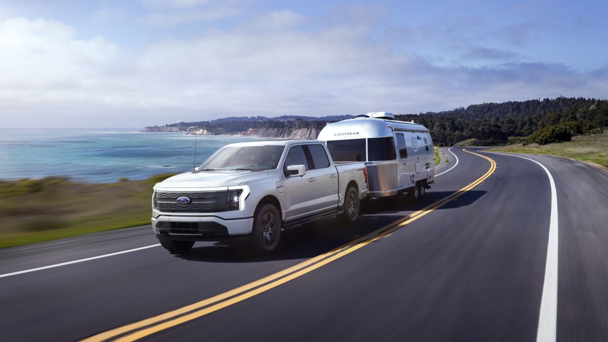 The Ford F-150 Lightning EV towing an Airstream.