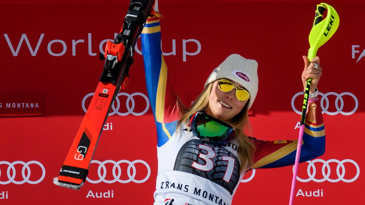 Mikaela Shiffrin celebrates on the podium after winning the Alpine combined event on Sunday in Switzerland.