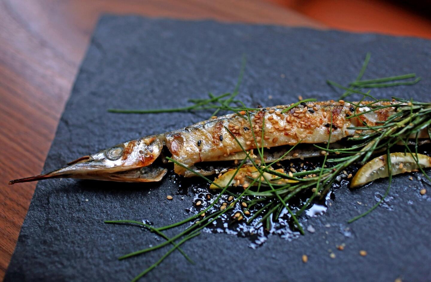Grilled needlefish is stuffed with rosemary sprigs from Orsa & Winston in downtown L.A.