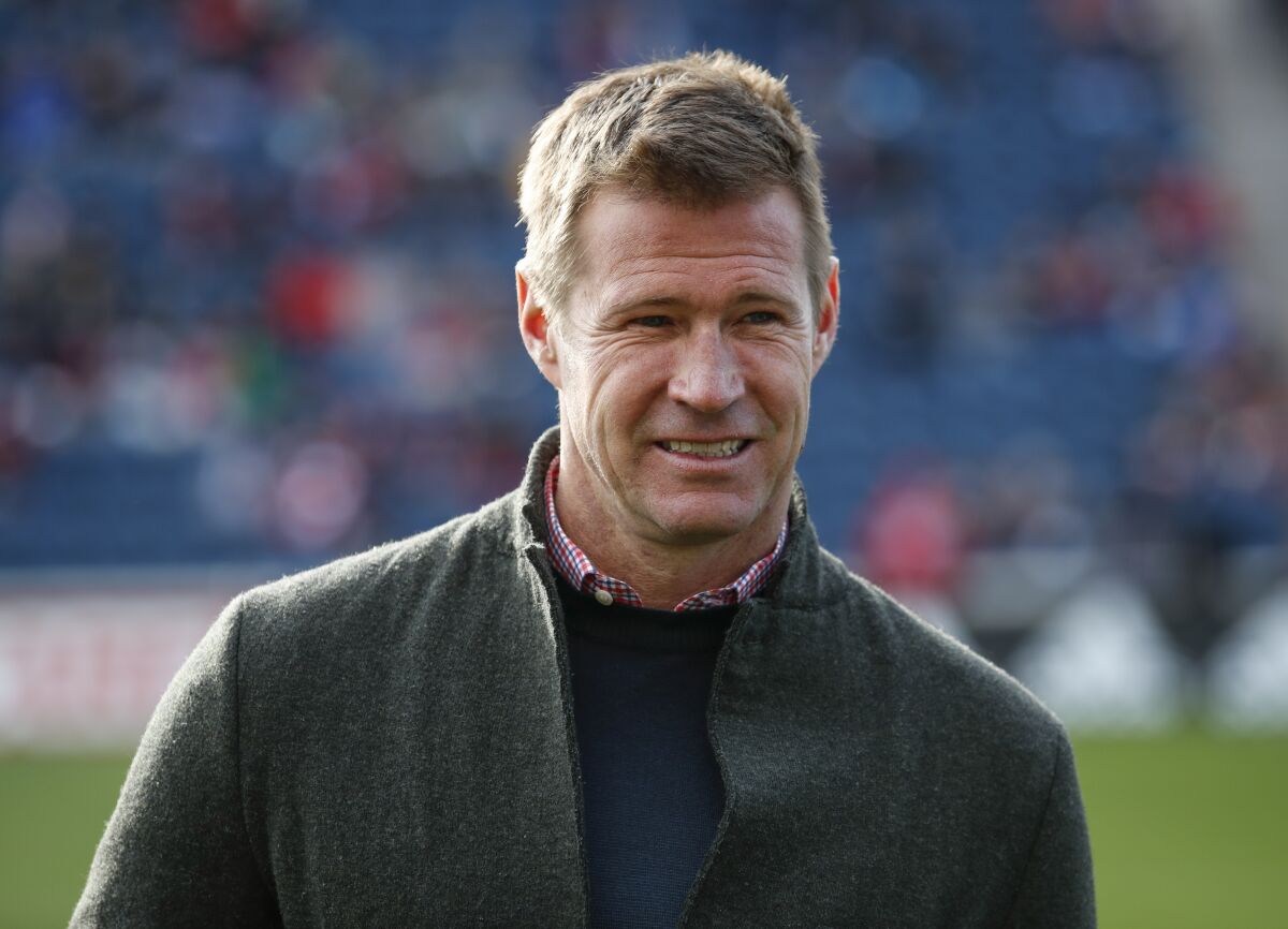 Former Chicago Fire forward Brian McBride looks on before an MLS soccer match 
