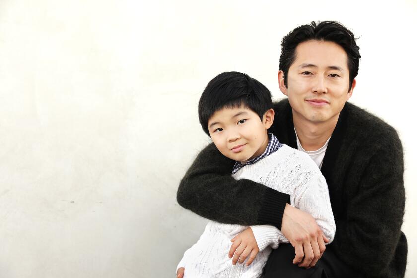 Steven Yeun, right, and Alan S. Kim,