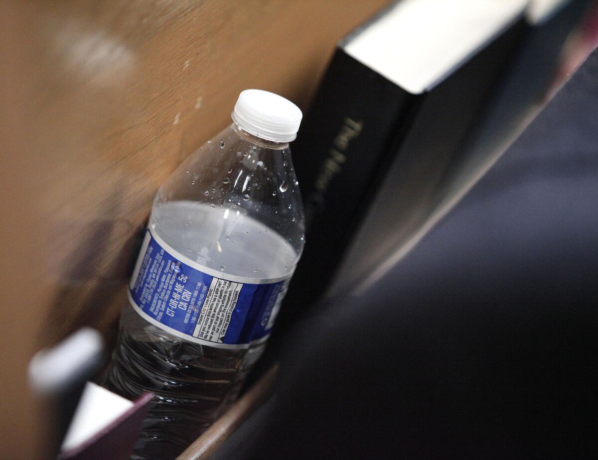 A bottle of water sits in a pew at Woodside Church in Flint, Mich., where Democratic presidential candidate Sen. Bernie Sanders attended a Feb. 25 community forum on the city's water crisis