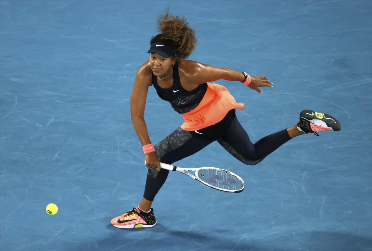 Naomi Osaka hits a forehand return during her victory over Jennifer Brady.