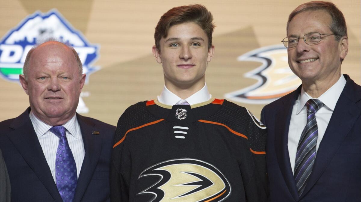 Trevor Zegras wears his new Ducks jersey after the team chose him in the first round of the NHL draft on June 21, 2019.