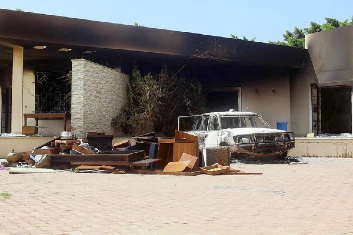 A burned car is visible after the deadly U.S. consulate attack in Benghazi, Libya. An FBI team visited the site this week.