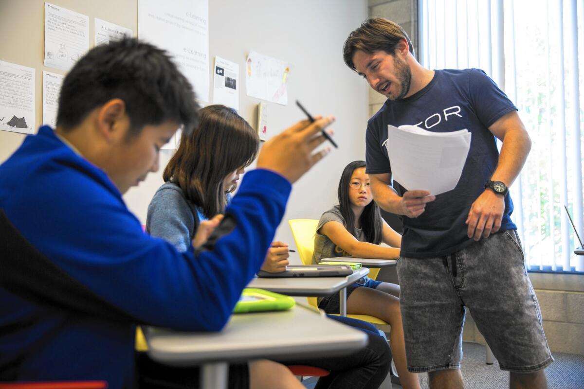 Instructor Kenneth Kakareka discusses notothenioids with students in his High School Prep Expository Analysis class at Chung Dahm ReadWrite.