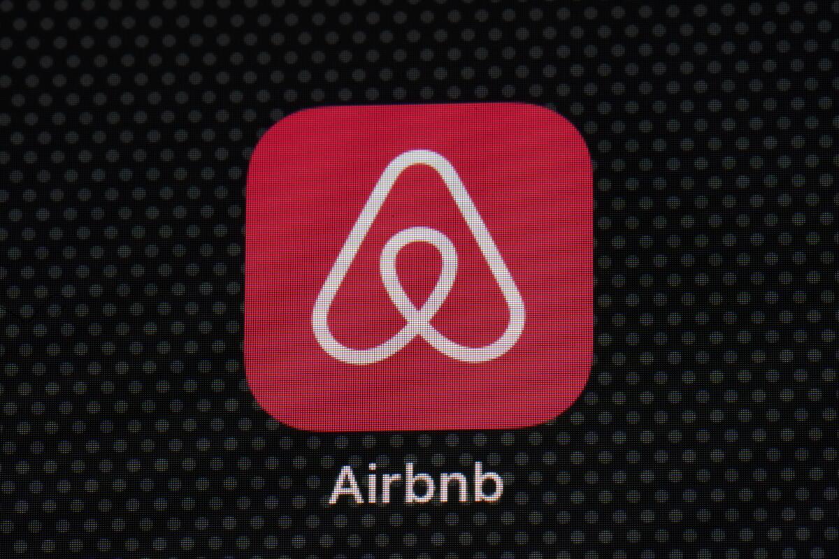 FILE - The Airbnb app icon is displayed on an iPad screen in Washington, D.C., on May 8, 2021. Airbnb announced Tuesday, Aug. 16, 2022, that it will use new methods to spot and block people who try to use the short-term rental service to throw a party. The company said it has introduced technology that examines the would-be renter's history on Airbnb, how far they live from the home they want to rent, whether they're renting for a weekday or weekend, and other factors. (AP Photo/Patrick Semansky, File)