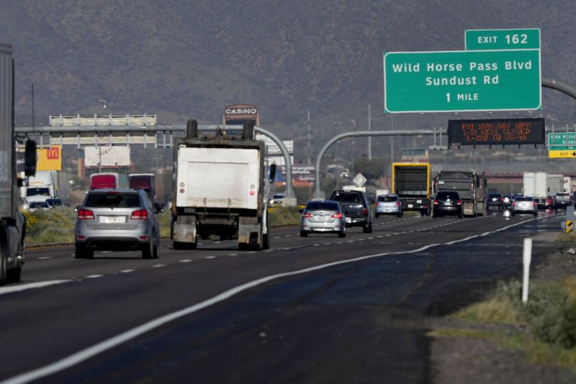 Traffic moves along the notoriously congested stretch of I-10 through tribal land called the Wild Horse Pass Corridor, Wednesday, Jan. 25, 2023 in Chandler, Ariz. With the Gila River Indian Community's backing, Arizona allocated or raised about $600 million of a nearly $1 billion plan that would widen the most bottleneck-inducing, 26-mile section of I-10 on the route between Phoenix and Tucson. But its request for federal money to finish the job fell short — a victim of the highly competitive battle for transportation grants under the new infrastructure law. (AP Photo/Matt York)