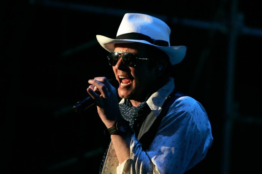 Singer Scott Weiland, shown performing in New York in July, says, "No one's ever fired anybody" from the Stone Temple Pilots, which recently announced it had "terminated" Weiland.