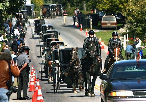 The funeral procession for Naomi Rose Ebersol, age 7, moves along Mine Road through the town of Bart in route to the cemetery.