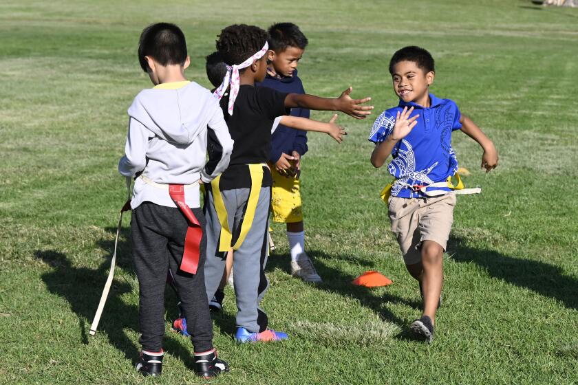 Children play flag football at the MLK Rec Center October, 10, 2022 in San Diego, Calif. (Photo by Denis Poroy)