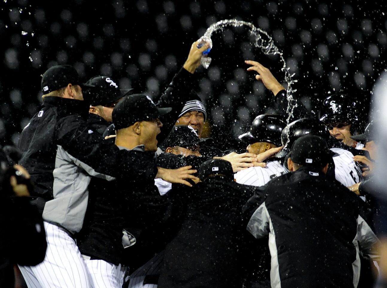 Melky Cabrera is mobbed by his teammates after his walk off sacrifice fly ball.