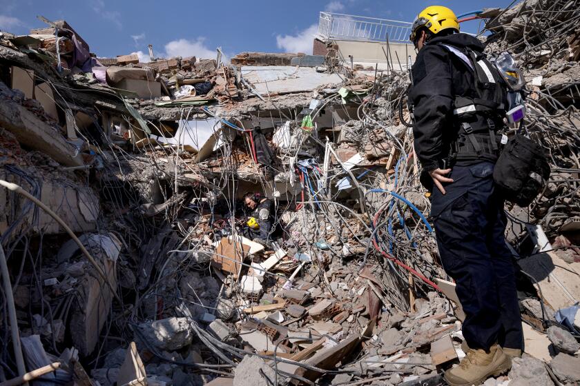 ¬©2023 Tom Nicholson. 10/02/2023. Adiyaman, Turkey. USAID Los Angeles County Fire Department Urban Search and Rescue teams use specialist listening devices at a destroyed building site in Adiyaman, Turkey, following the earthquake on 6 February. Over 23,000 people across Syria and Turkey have died, whilst vast surrounding areas are also suffering severe damage to infrastructure.